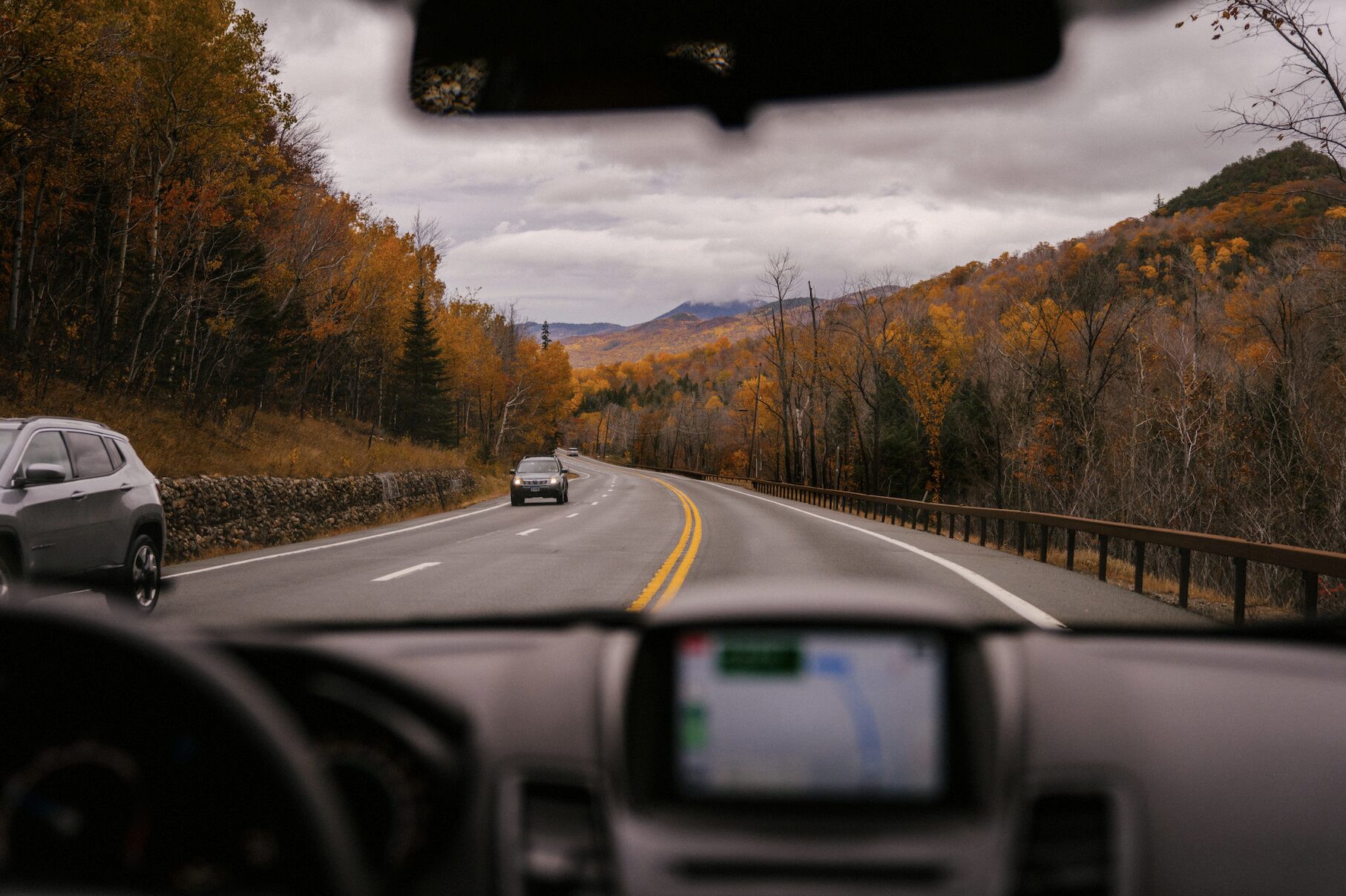 View from inside a car looking out the windshield while driving